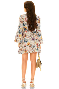 Back view of white floral wrap mini dress with long sleeves