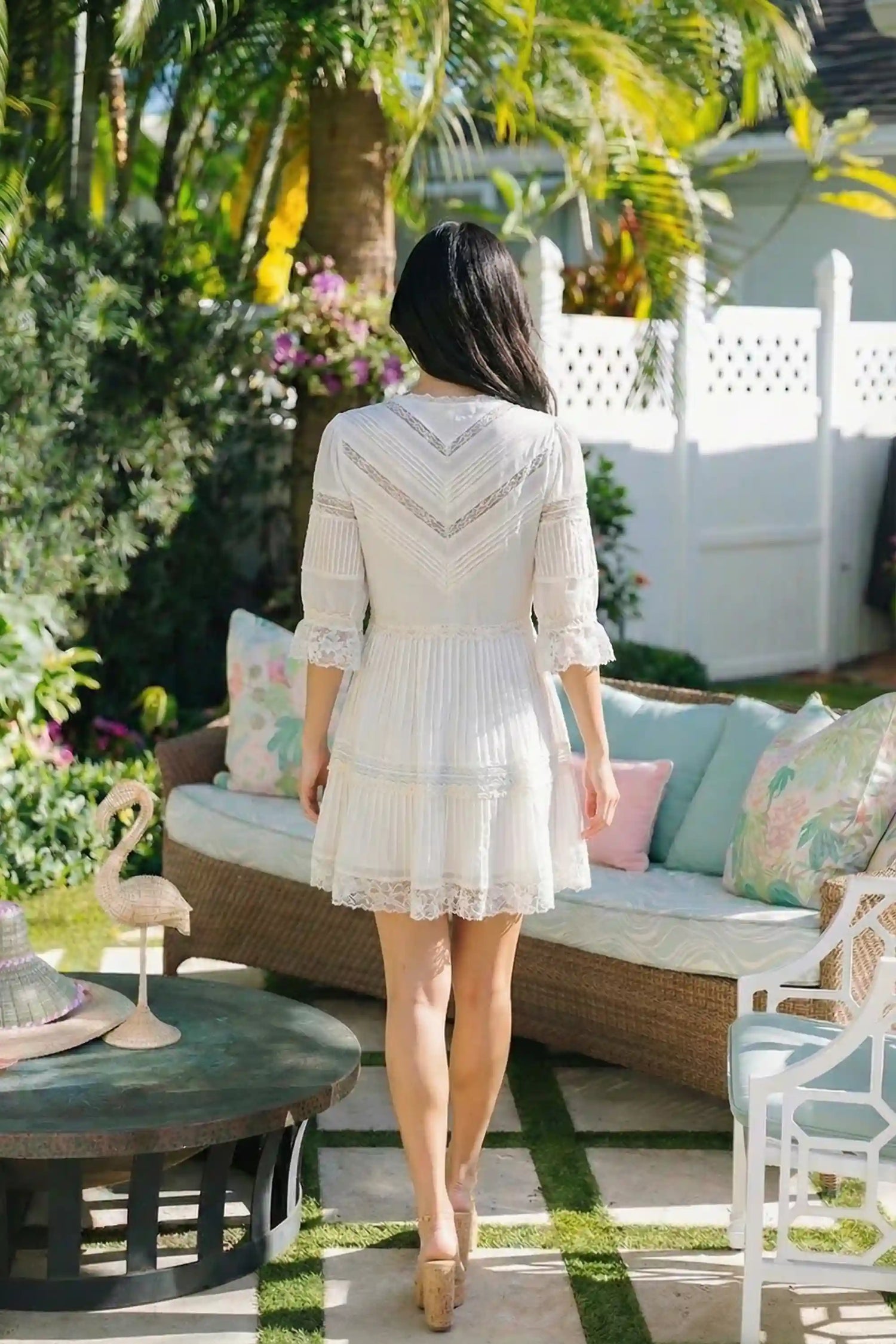 Pretty Pixie white lace trim pleated v-neck tiered mini dress back view puff sleeves