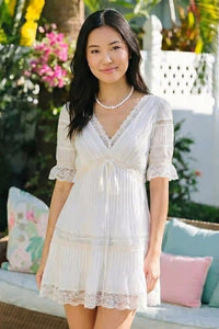 Pretty Pixie white lace trim pleated v-neck tiered mini dress side view tiered skirt