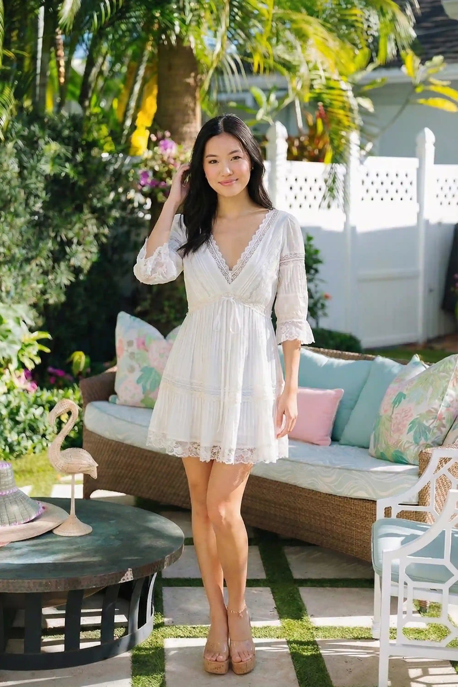 Pretty Pixie white lace trim pleated v-neck tiered mini dress front view puff sleeves