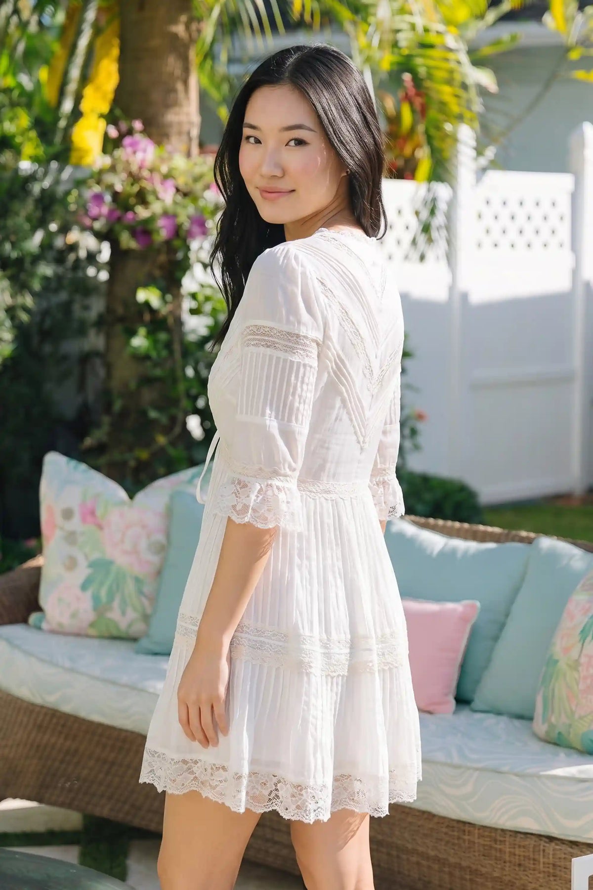 Pretty Pixie Off White lace-trim pleated v-neck tiered mini dress for women, back view