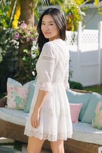 Pretty Pixie Off White lace-trim pleated v-neck tiered mini dress for women, back view