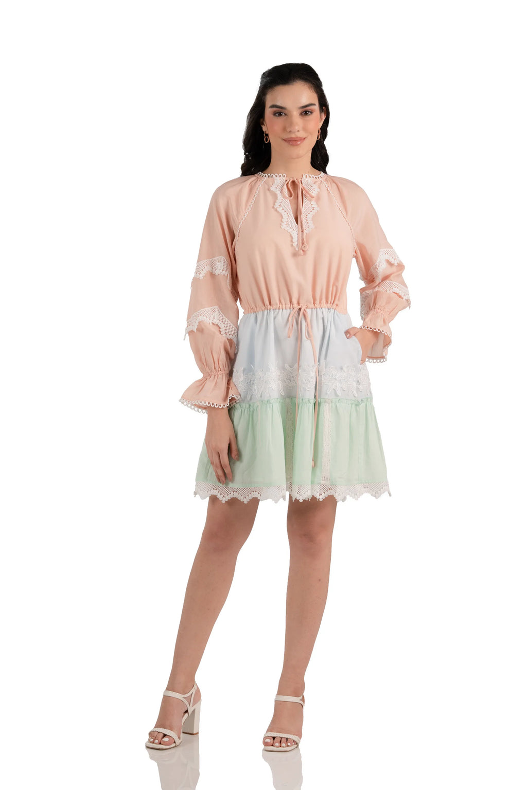 Front view: peach mint lace tiered mini dress with long sleeves and pockets