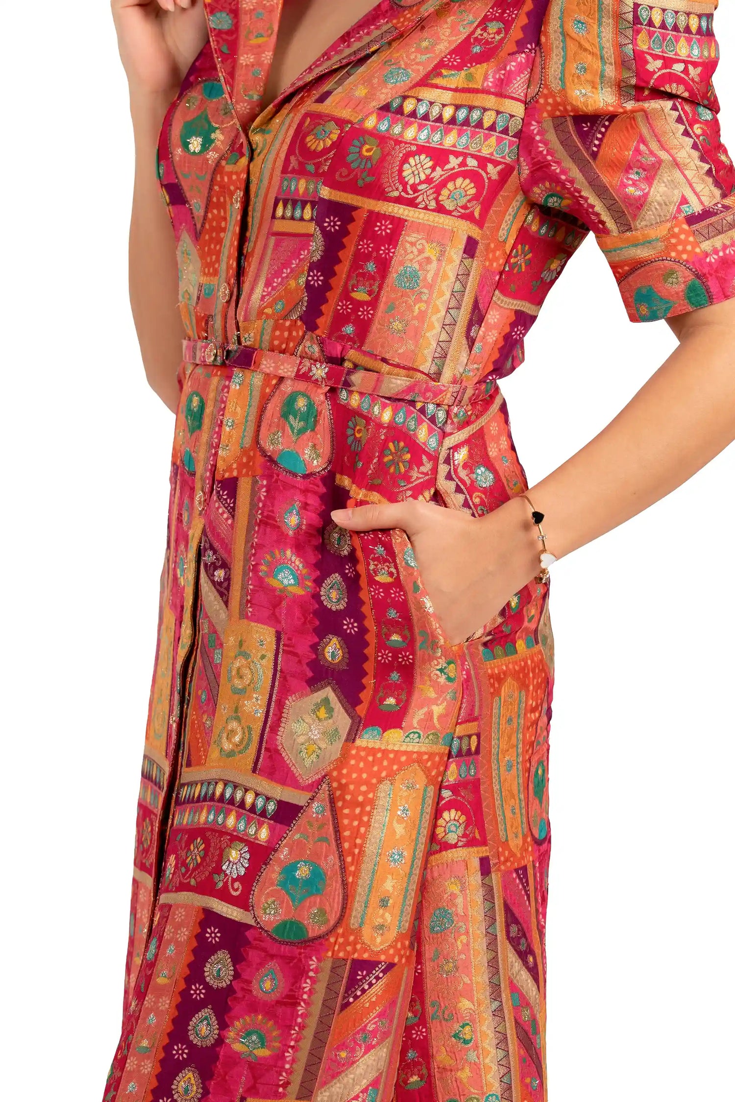 Close-up of belt and pocket on fuchsia patchwork midi shirt dress