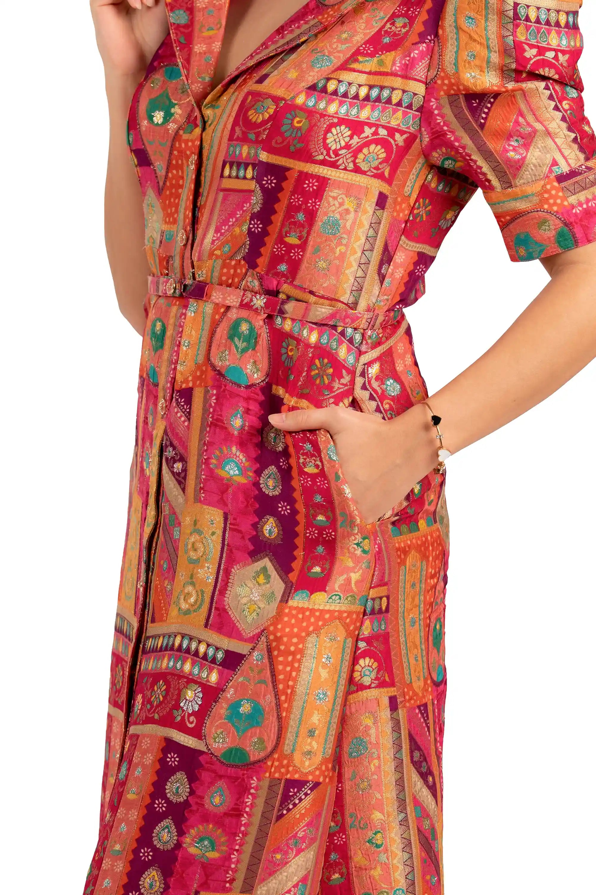 Close-up of belt and pocket on fuchsia patchwork midi shirt dress