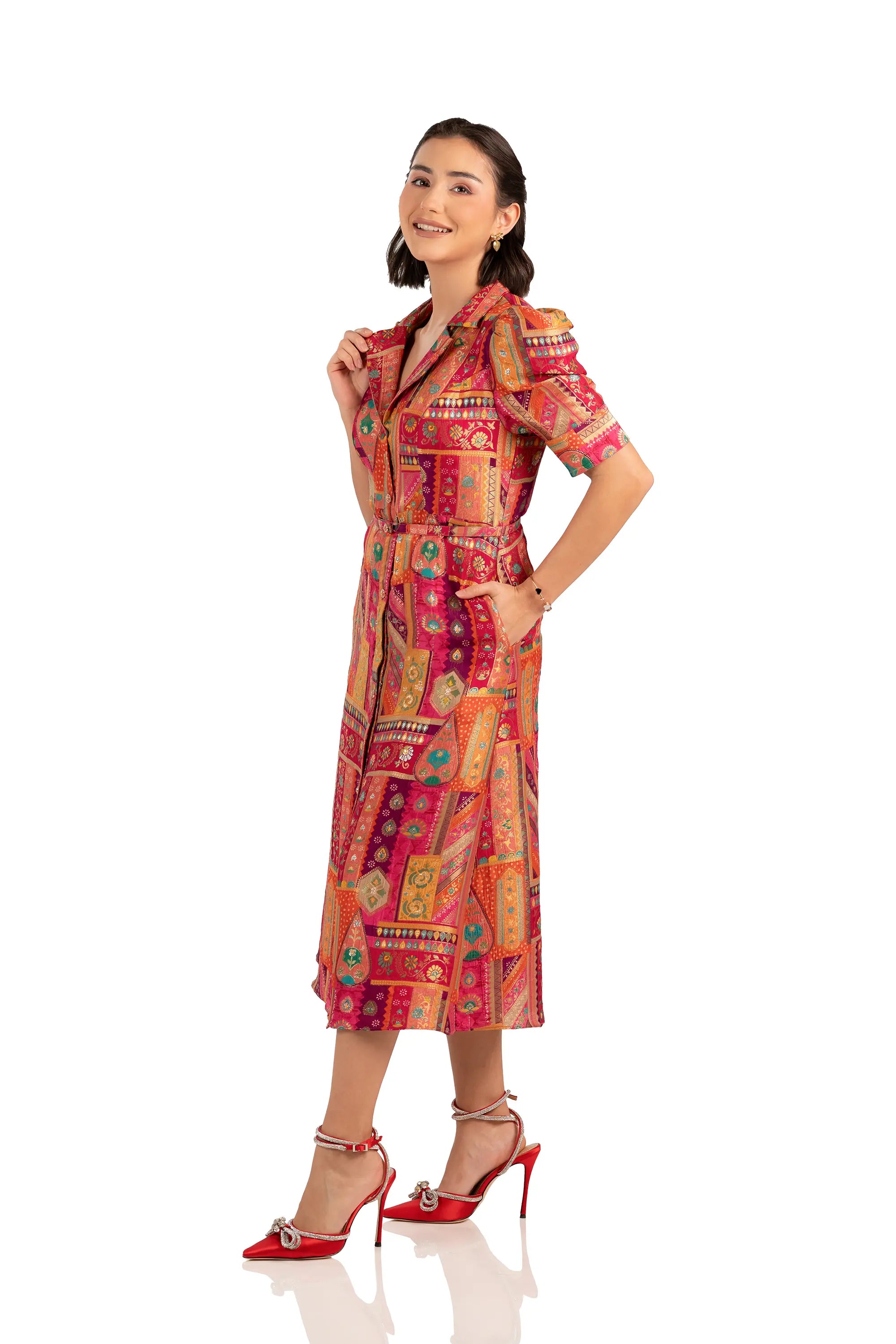 Side view of fuchsia patchwork midi shirt dress with pockets and belt