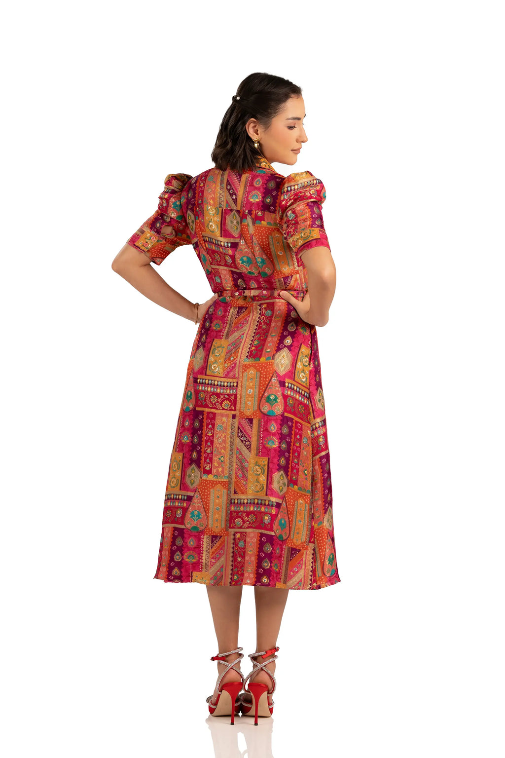 Back view of fuchsia patchwork midi shirt dress with belt and puff sleeves