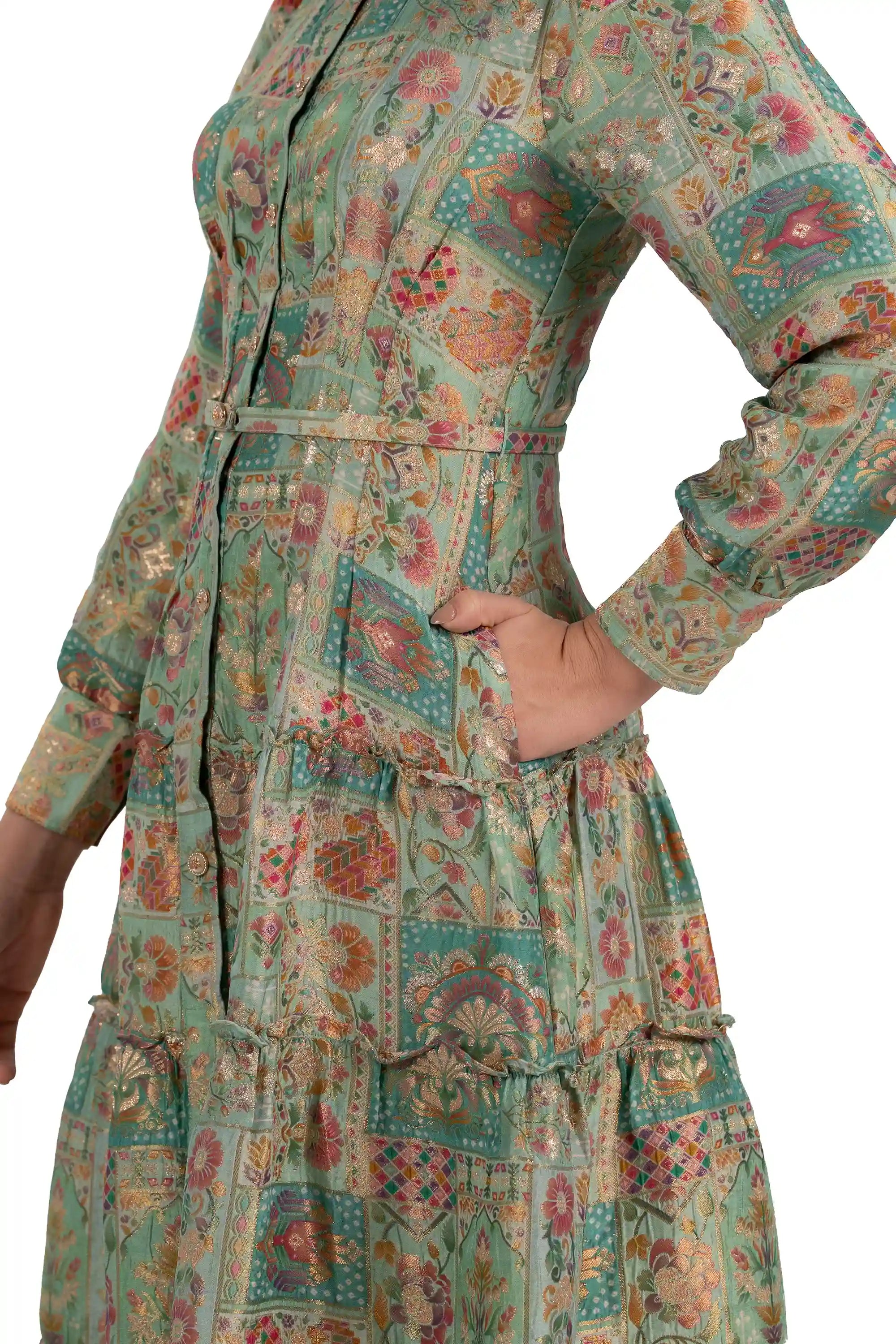 Close-up of belt, pocket and tiered skirt on mint patchwork midi dress