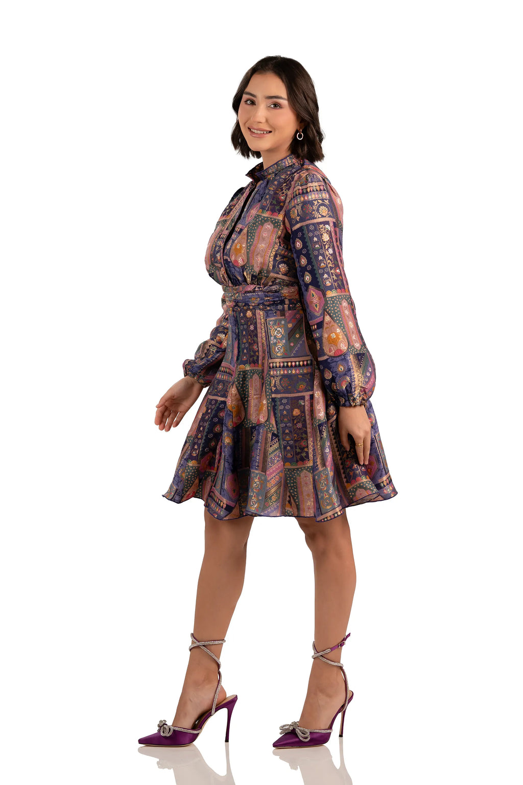 Model in navy boho patchwork mini dress, belted waist, long sleeves, side right view