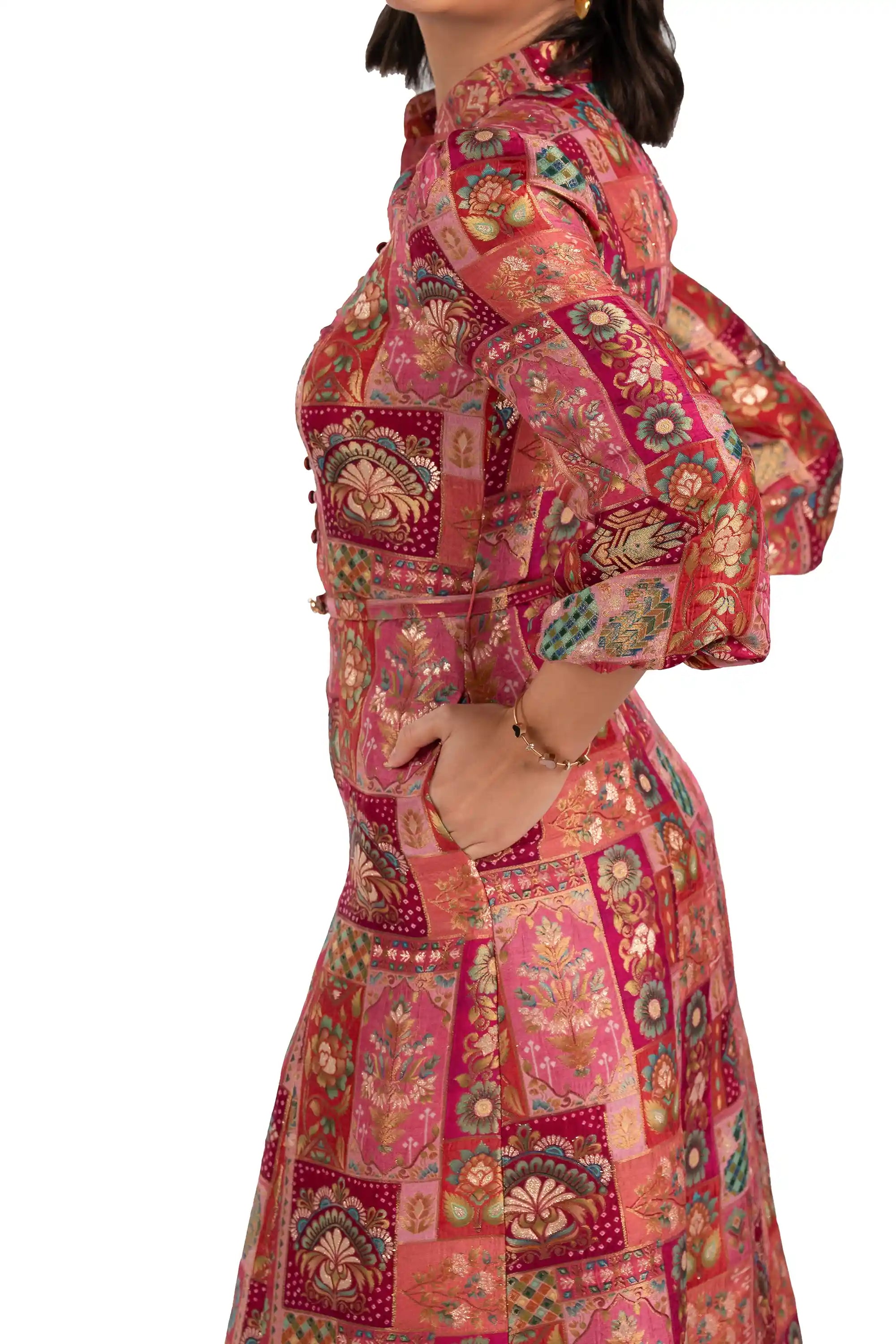 Close-up of belt and pocket on rose patchwork midi dress with long sleeves