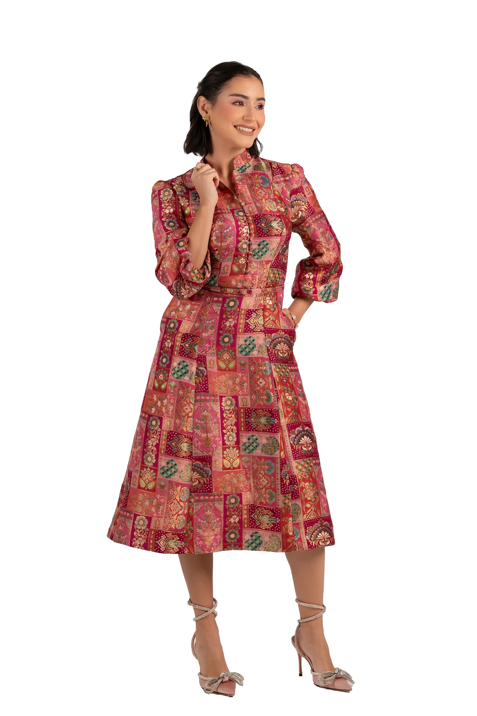 Three-quarter view of rose patchwork midi dress with belt and long sleeves