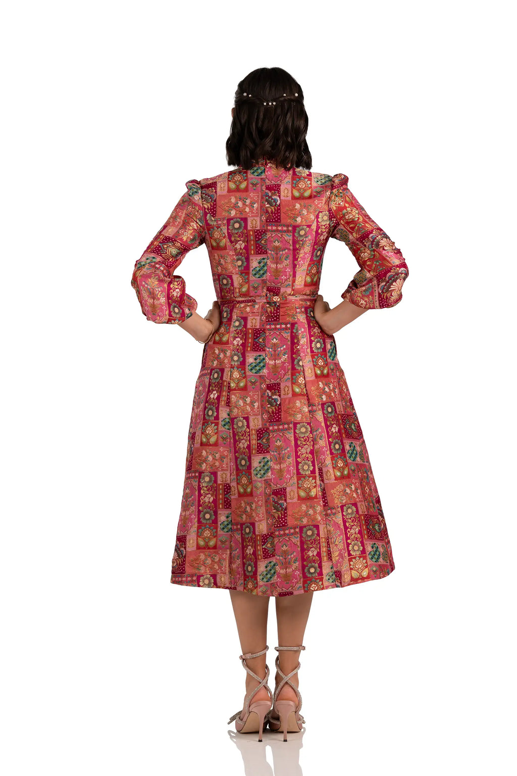 Back view of rose patchwork midi dress with belt and puffed sleeves