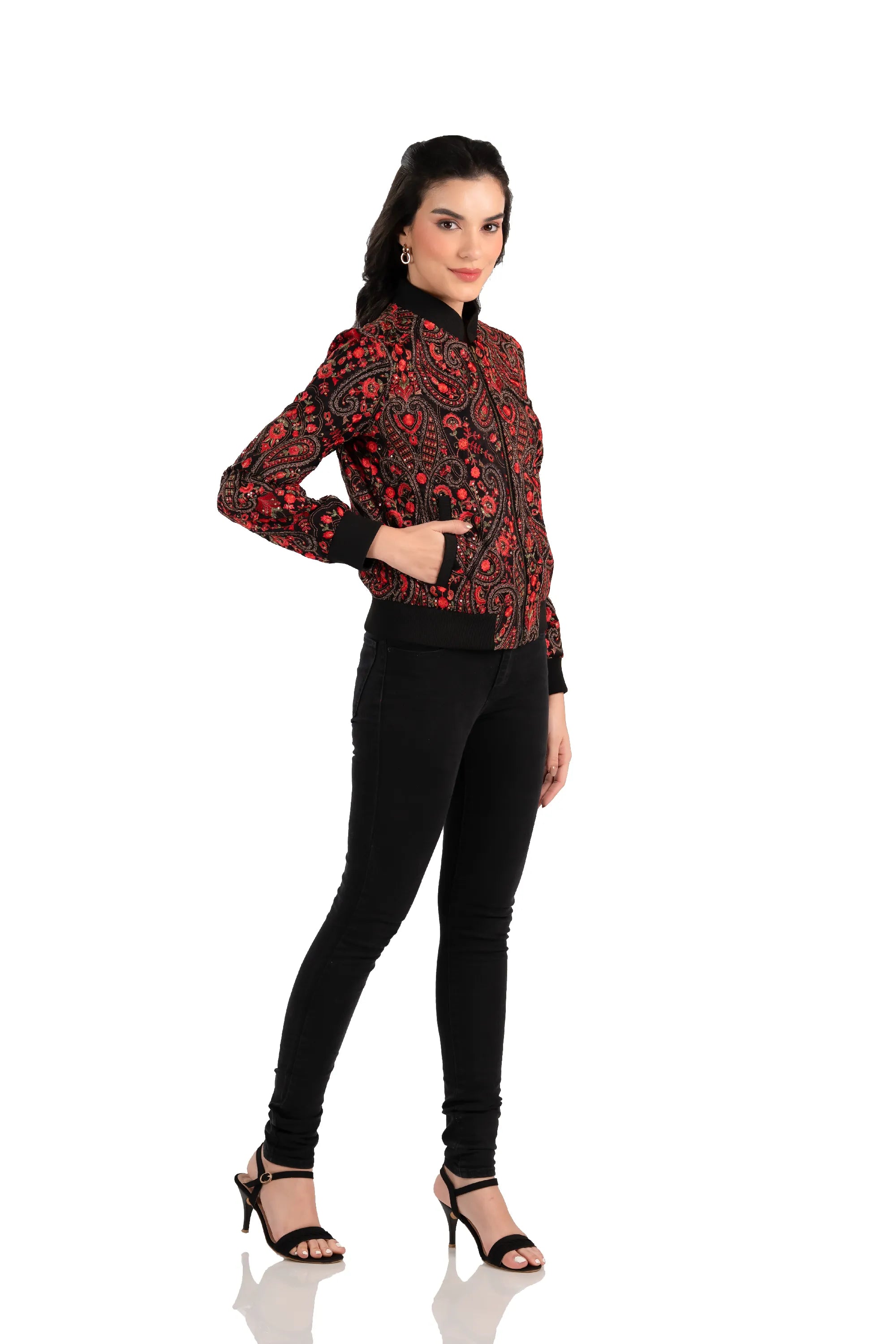 Woman in red paisley embroidered black bomber jacket, side view with pockets
