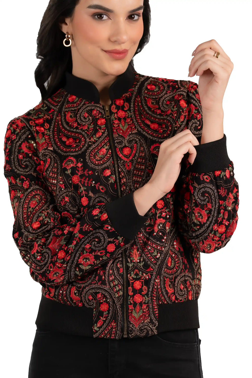 Close-up of red paisley embroidery and zipper on black women’s bomber jacket