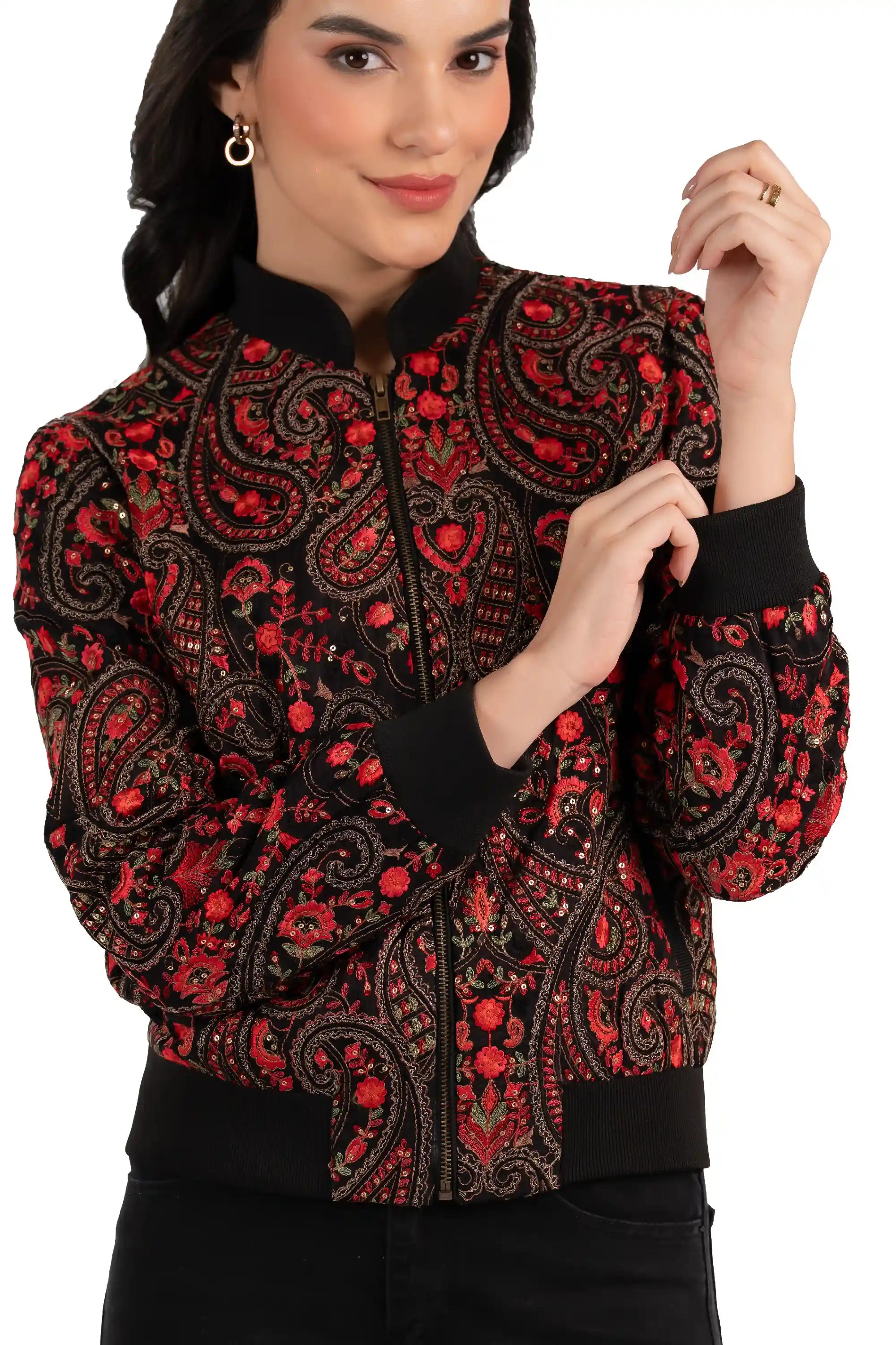 Close-up of red paisley embroidery and zipper on black women’s bomber jacket