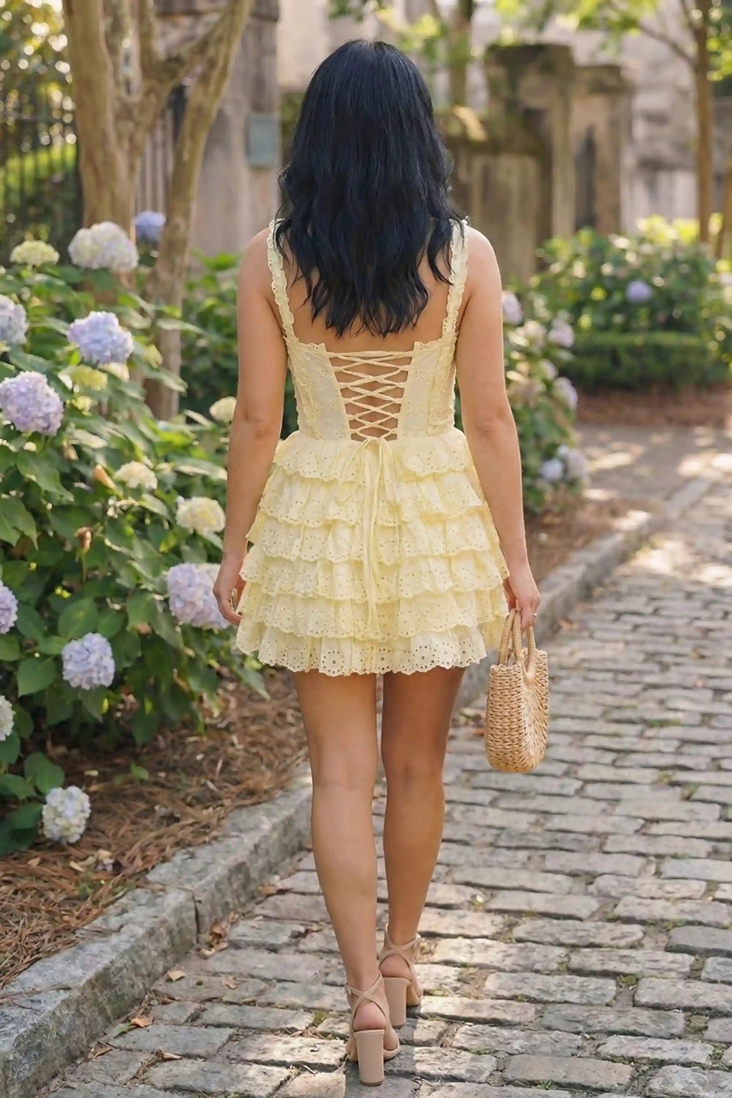 Pretty Pixie buttercream yellow eyelet corset mini dress back view lace-up tie garden