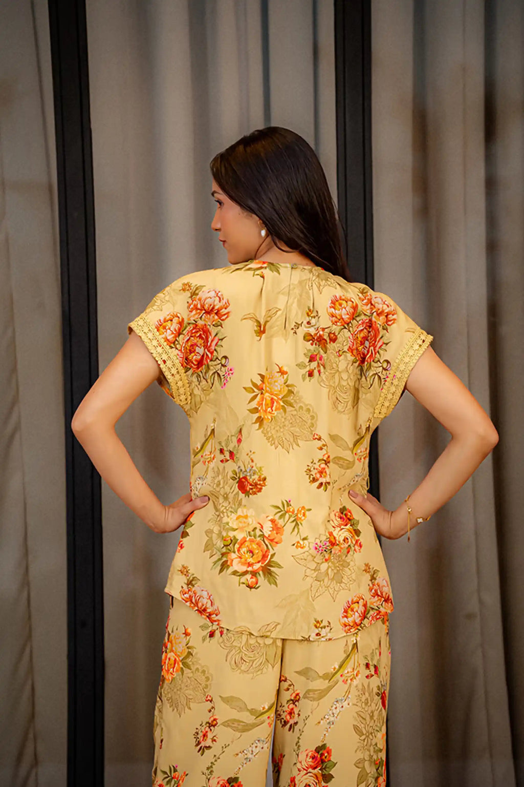 Back view of yellow floral co-ord set with intricate floral.