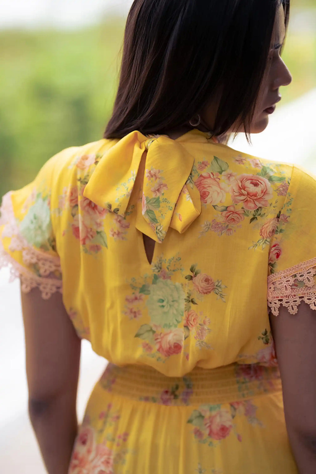 Yellow floral short dress with bow tie detail back view