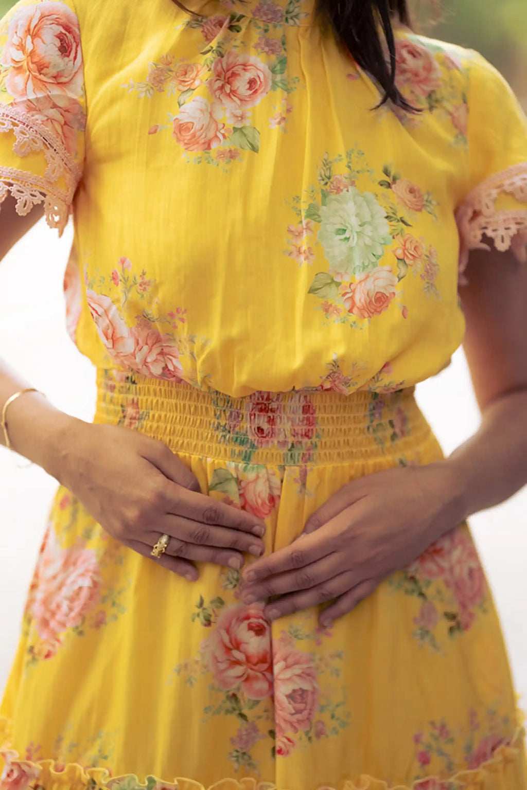 Waist smocking detail on yellow floral short dress