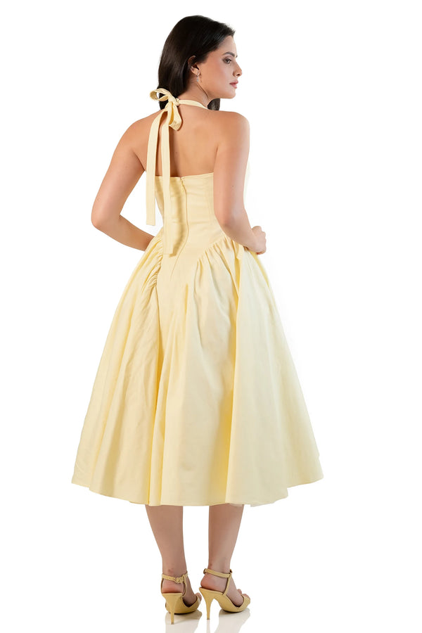 Back view: yellow halter midi dress with tie bow and zipper