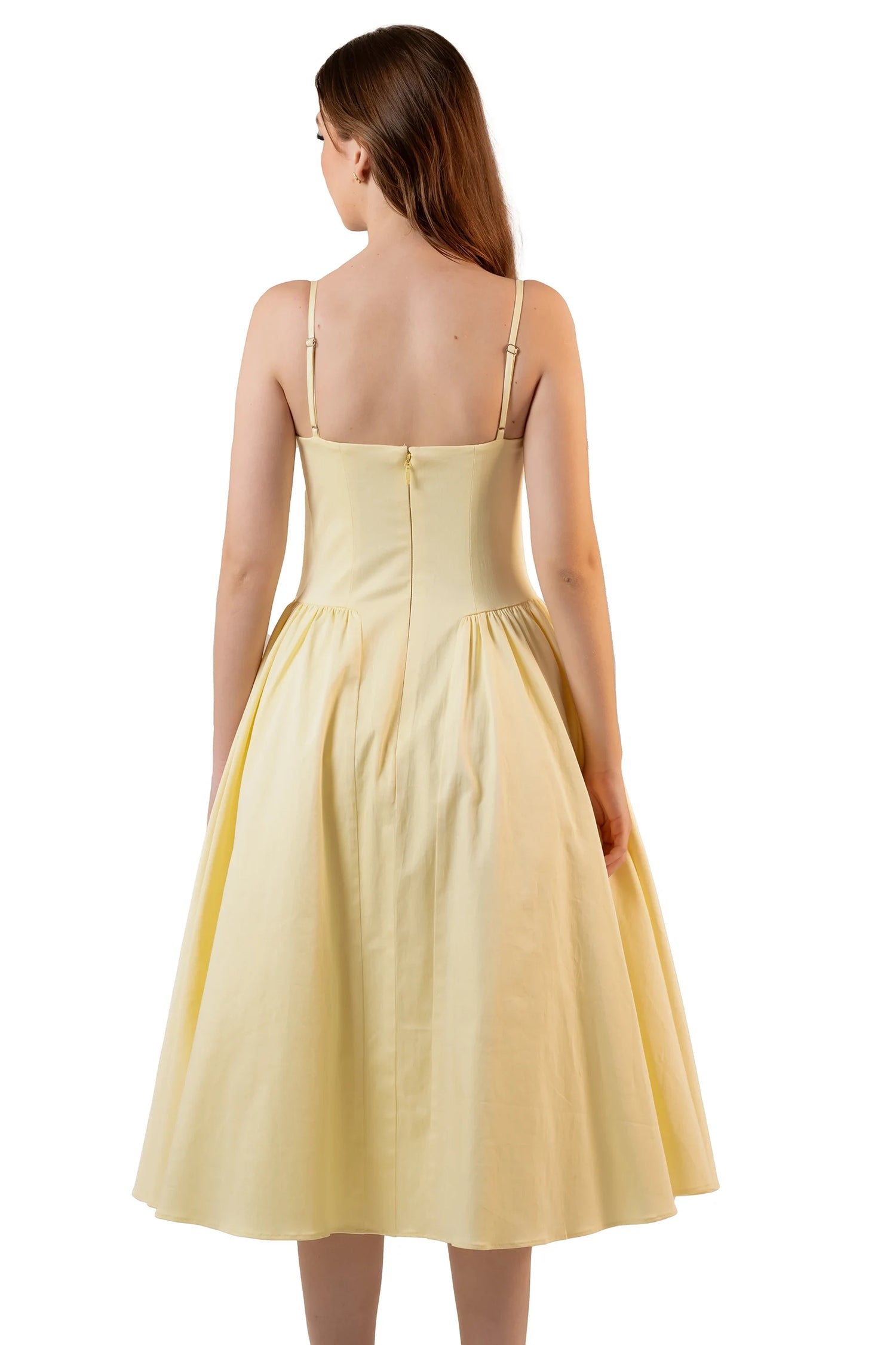 Back view of yellow spaghetti strap midi dress with flared skirt