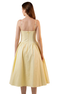 Back view of yellow spaghetti strap midi dress with flared skirt